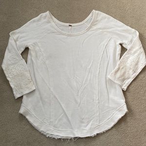 Free People large cotton tunic with distressed hem and eyelet detailed sleeves